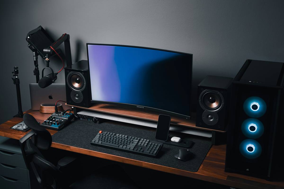 Top PC gaming speakers setup on gaming desk with RGB lighting and clean cable management