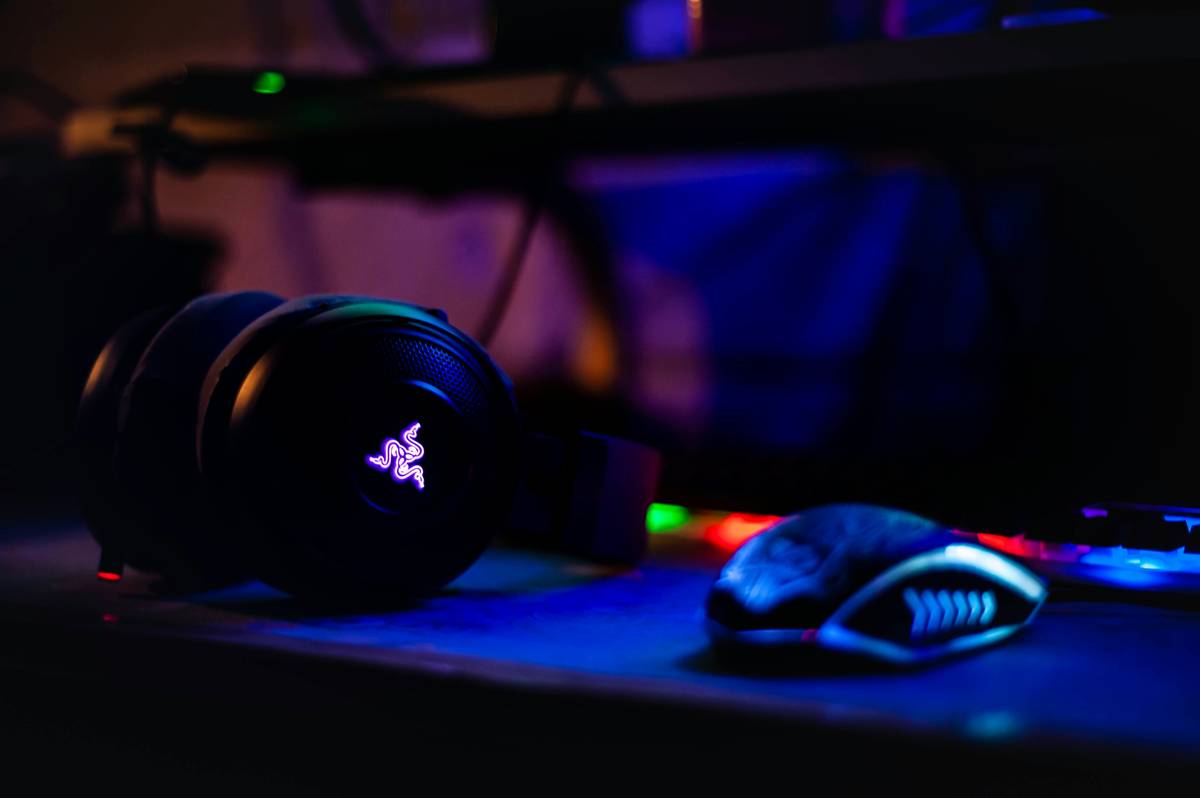 speakers for gaming computer placed symmetrically on a gaming desk with acoustic foam panels on nearby walls